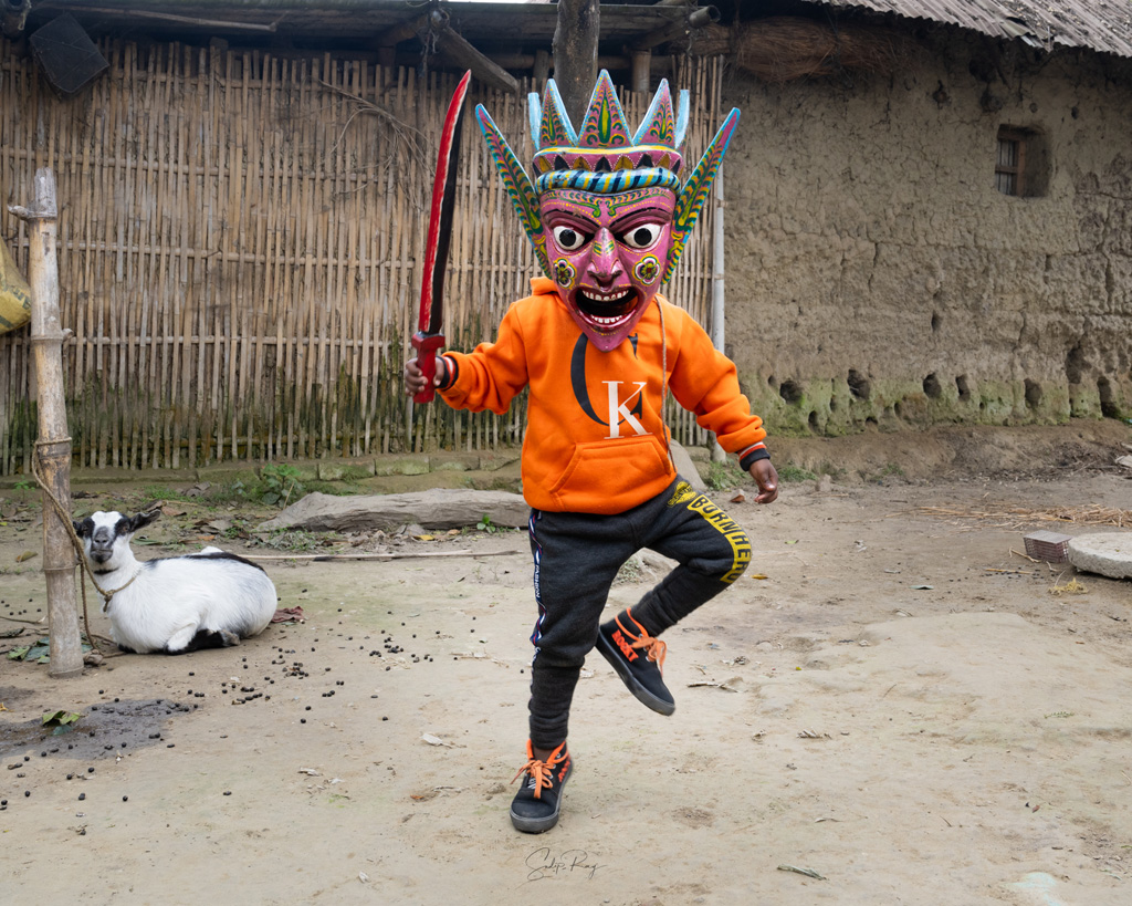 A kid wearing Gomira mask